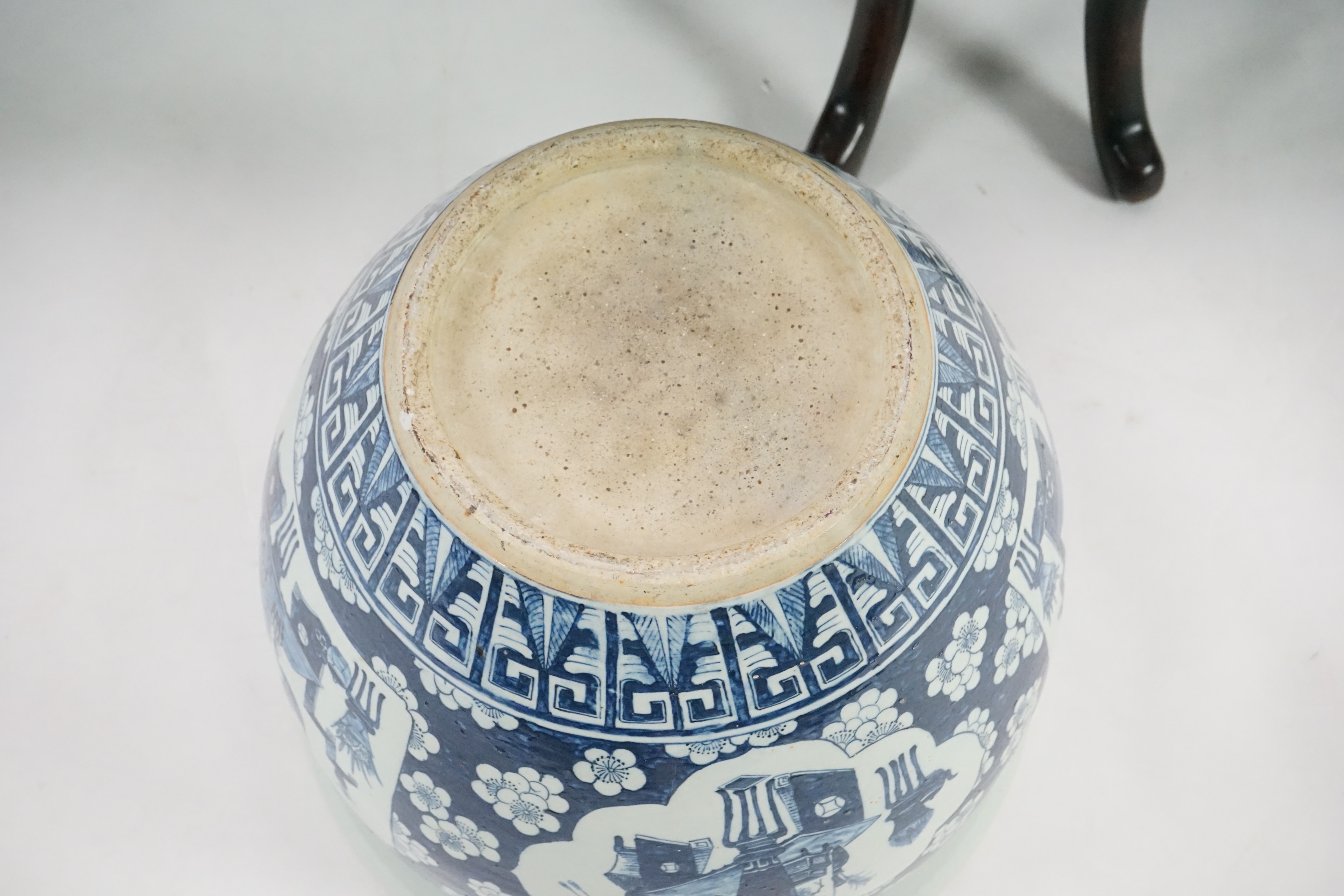 A large Chinese blue and white ‘Hundred Antiques’ jardinere and hongmu stand, late 19th/early 20th century
